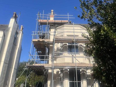Scaffolding erected at the front of old style UK house in Nottingham | East Midlands