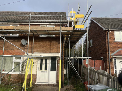 Scaffolding erected on UK house to fix roof with saftey gates in Nottingham | East Midlands